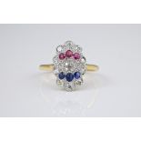 An antique 18ct gold, platinum, ruby, sapphire and diamond Empire style ring the shallow,