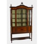 A fine quality Edwardian mahogany and marquetry glazed vitrine by Maple & Co. the flared, broken