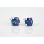 A pair of 18ct white gold and sapphire stud earrings the round cut sapphires totalling 2.19ct. (2)