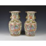 A pair of Chinese Canton famille rose vases 19th century, baluster form with everted scalloped rims,