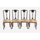 A set of four Art Nouveau style mahogany dining chairs c.1910, with floral carved splats and stuff