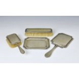 An Austrian silver four piece dressing table set of shaped rectangular form having ribbed rim and