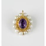 A Victorian style yellow gold, amethyst and pearl pendant the double sided pendant with a central
