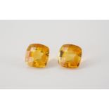 A pair of loose, unmounted citrine gemstones cushion cut, 8.01ct total. (2)