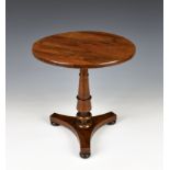 A mid-19th century miniature apprentice piece rosewood table the circular veneered top on a