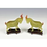 A pair of Chinese carved hardstone goats probably mid twentieth century, the realistic goats in
