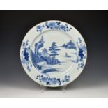 A large Chinese export porcelain blue and white charger late 18th century, painted with a pagoda