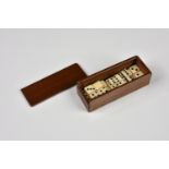 A 19th century set of miniature bone dominoes in polished wooden case the twenty three dominoes