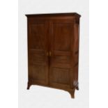 An early 19th century Jersey mahogany and yew wood six panel clothes press the flared dentil cornice