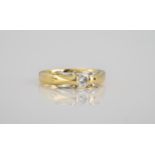 An 18ct gold, platinum and diamond limited edition Millennium ring the single brilliant cut