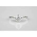 An 18ct white gold and diamond engagement ring the central 1.0ct brilliant cut diamond with HRD