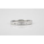 A platinum and diamond half eternity ring millegrain set with brilliant cut diamonds, total 0.