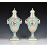 A pair of 19th century Sèvres style porcelain slender lidded vases probably Dresden, with ram's head