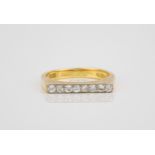 An 18ct yellow gold and diamond ring hallmarked London 1977, the flat topped, burnished shank set