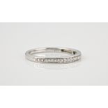 A 9ct white gold and diamond half eternity ring pavé set with brilliant cut diamonds, size M½.