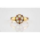 A Victorian 18ct gold, opal and ruby floral cluster ring hallmarked Birm. 1870, size O.