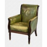 A William IV mahogany framed library armchair upholstered in green leather the reeded back
