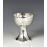An Arts and Crafts planished silver chalice Harrods Stores Ltd (Richard Burbridge), London 1914,