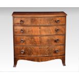 An early 19th century Channel Islands bowfront figured mahogany four drawer chest the rosewood cross