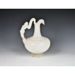 A classical style carved alabaster ewer 20th century, with a figural handle of a bearded man, the
