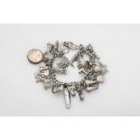 A vintage silver charm bracelet lacks clasp, with various Channel Islands charms including a