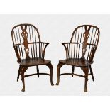 A pair of George III faux grained beechwood and elm stick back Windsor armchairs with a pierced vase