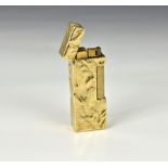 A Dunhill 9ct gold bark effect lighter stamped 'Dunhill London' and hallmarked to base, 6.5cm. long.