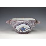 A Brussels faience tureen late 18th / 19th century, the circular tureen with shell handles,
