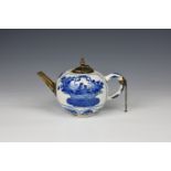 A Chinese porcelain blue and white teapot 18th century, with white metal mounts, the globular body