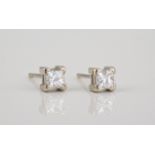 A pair of 18ct white gold and Princess cut diamond stud earrings H, VS1, total weight 0.47ct. (2)