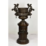 A large Neo-classical bronze urn on a column base after a design by Claude Ballin for Parterre du