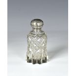 An Edward VII silver mounted cut glass perfume bottle David Loebl, London 1906, the pull-off