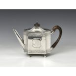 A George III silver teapot Henry Chawner, London 1792, the shallow domed lid with wooden finial