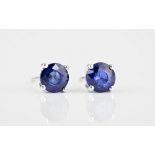 A pair of 18ct white gold and sapphire stud earrings the round cut sapphires totalling 1.92ct. (2)