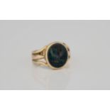 A Victorian 18ct gold and bloodstone intaglio seal ring with intaglio crest to the oval
