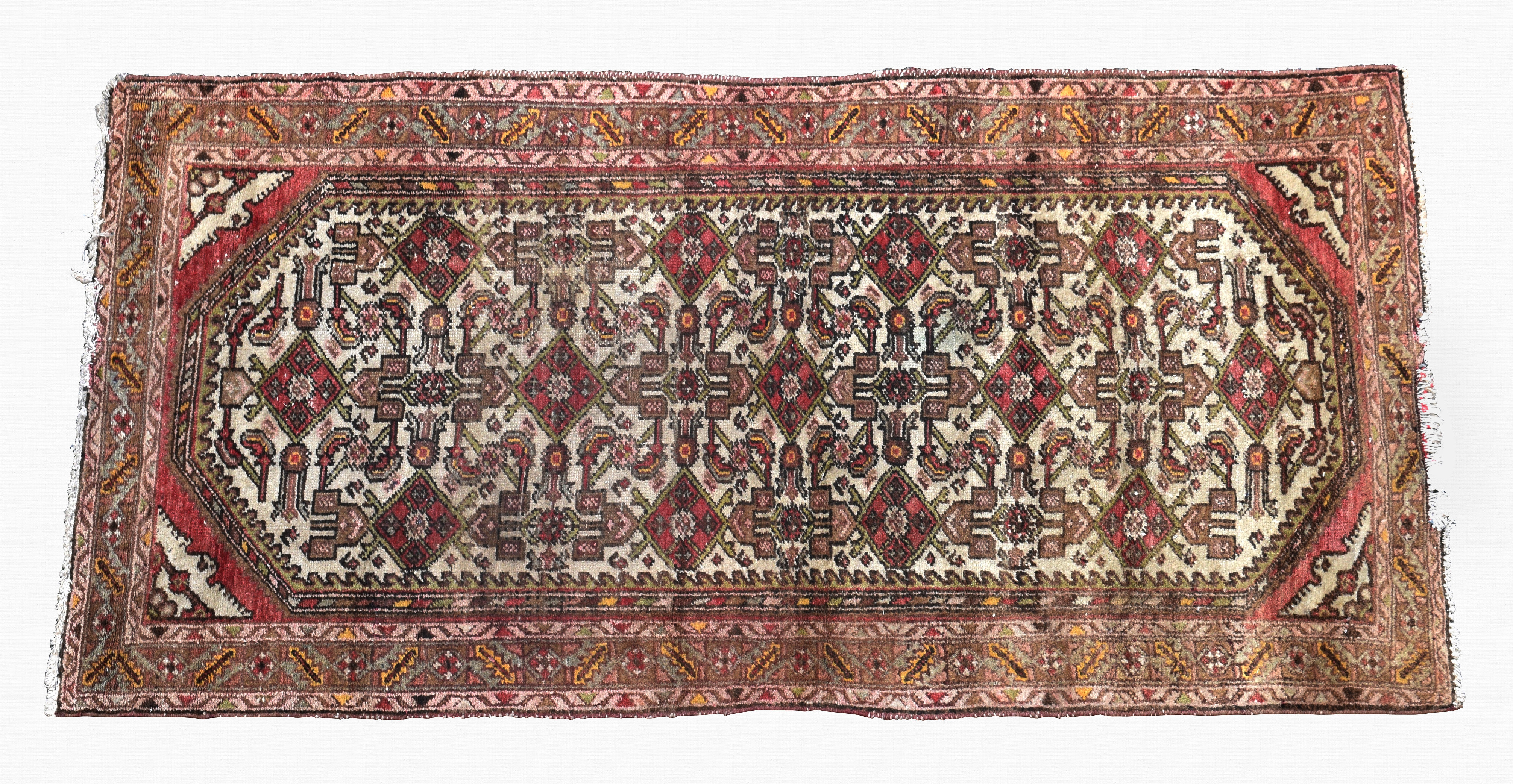 An Iranian rug mid-20th century, the ivory field with hooked edge and all over stylised floral