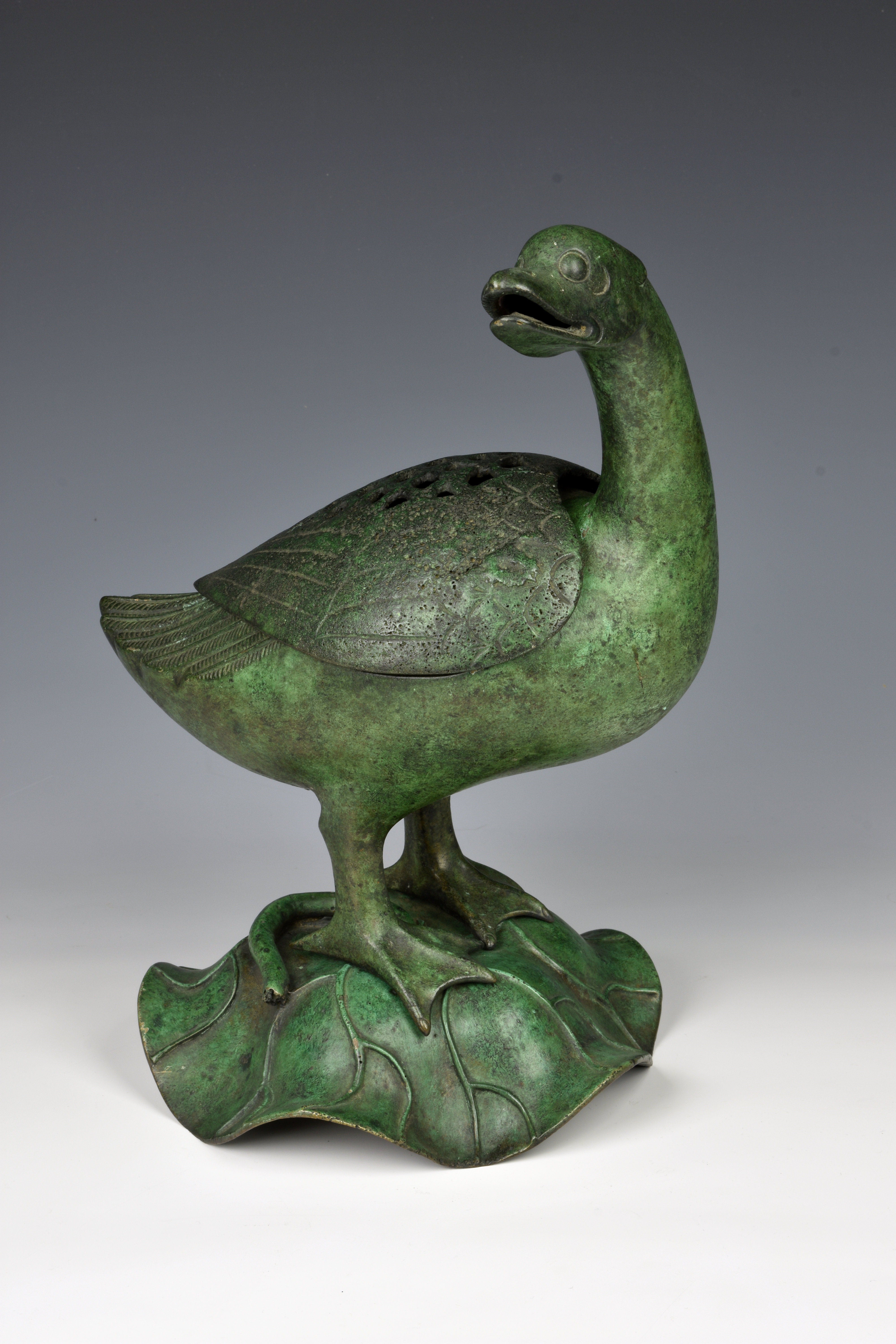 A Chinese patinated bronze duck censer probably 20th century, with verdigris patination, the duck