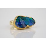 A striking handmade 18ct yellow gold and black opal ring the large, abstractly shaped opal measuring