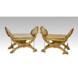 A pair of neo-classical giltwood x-frame stools mid-20th century, the oval sides with buttoned