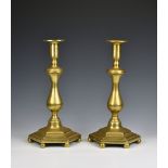 A pair of large Victorian brass candlesticks with baluster stems and hexagonal bases with six ball