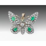 A good antique yellow gold, platinum, emerald and diamond butterfly pendant brooch 1920s, set with