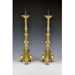 A pair of 17th / 18th century Flemish brass pricket candlesticks each with a circular drip pan