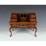 A yew wood veneered miniature Carlton House desk 20th century, the central writing surface with
