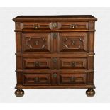 A Charles II joined oak and fruitwood two part chest of drawers the three plank top with thumb
