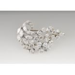 A fine platinum and diamond floral brooch by Bonebakker designed as a cascade of brilliant and