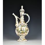 A faience lidded wine ewer of typical Islamic form the tapered teardrop body with slightly flared