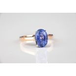 An 18ct rose gold and sapphire ring with oval cut 4.39ct Ceylon sapphire, size M.