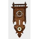 A late 19th century French wall clock with barometer and thermometer the mahogany and stained