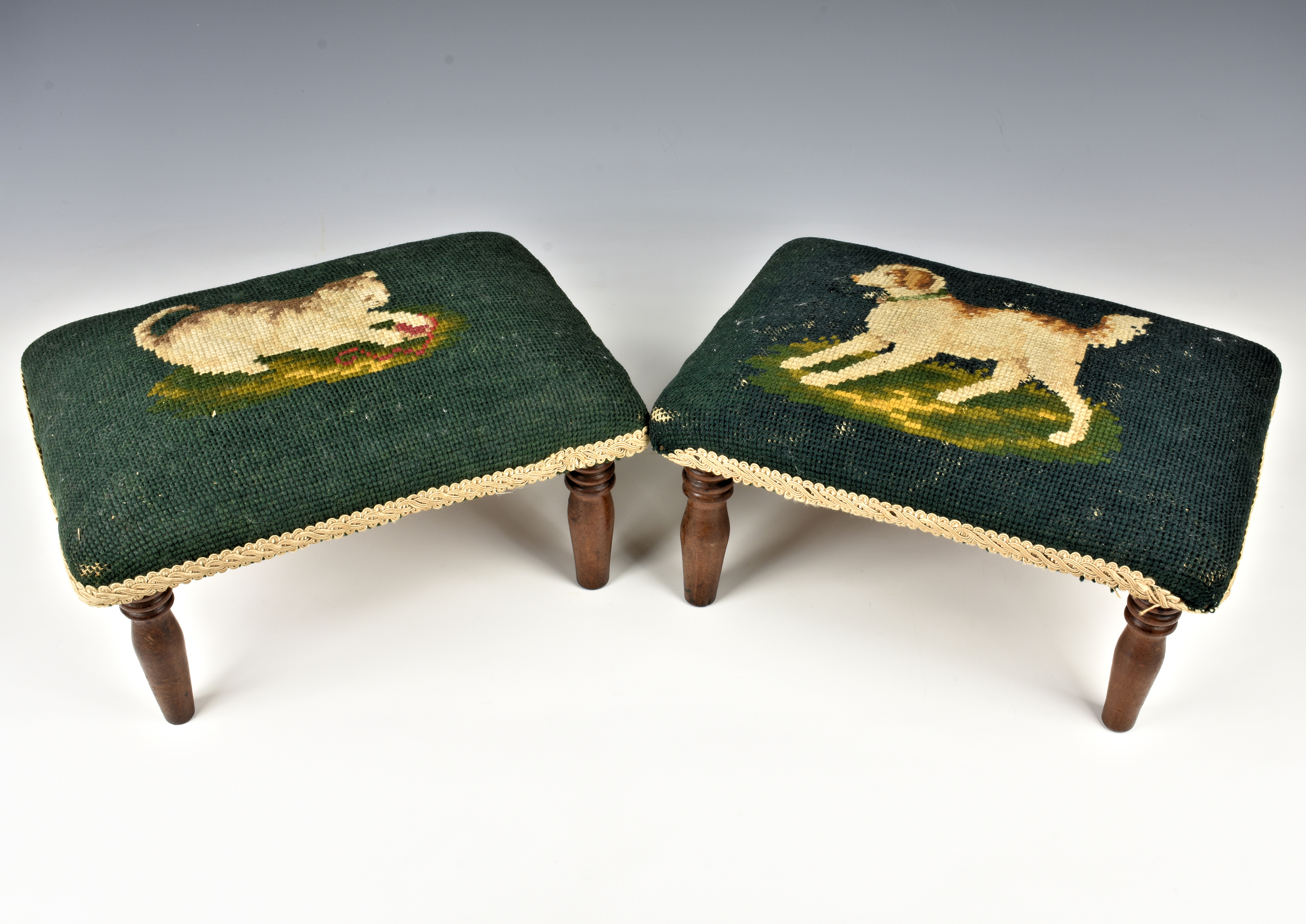 A pair of Victorian embroidered foot stools the rectangular cushions embroidered with a kitten