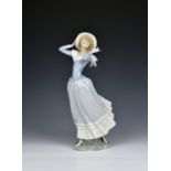 A Lladro porcelain figure, Spring Breeze no. 4936, sculpted by Vincente Martinez, 14in. (35.5cm.)